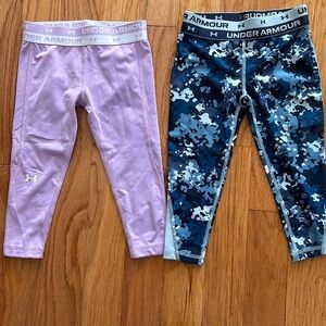 Set of 2 under armour girls athletic leggings.  1 light purple 1 blue camouflage